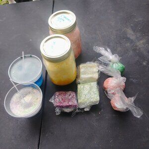 Homemade bath bombs, water candles, sugar scrubs, and bar soaps.